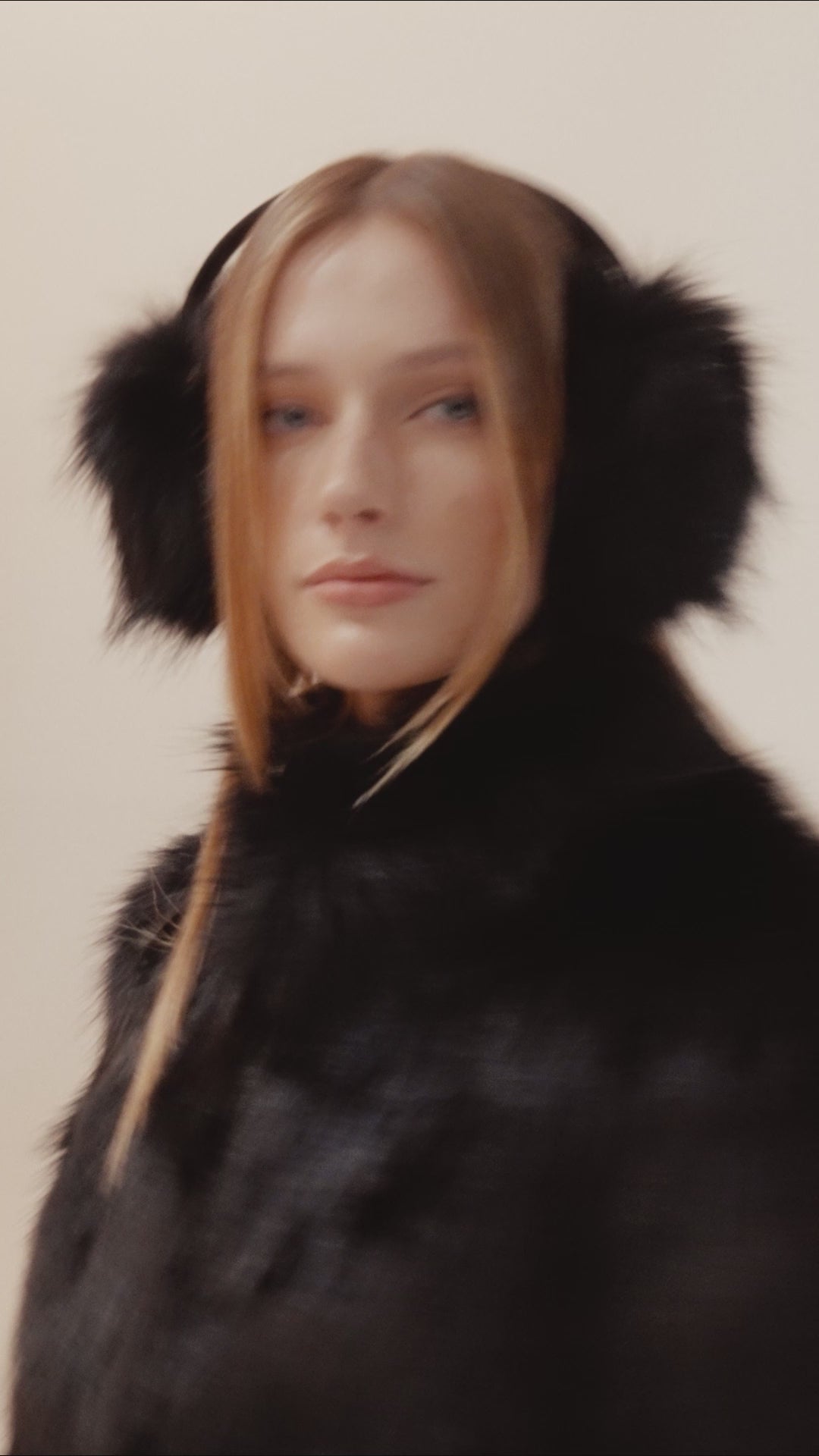 Model in faux fur on set
